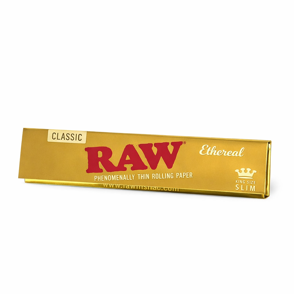 RAW Ethereal King Size Slim rolling paper booklet in gold branded packaging displayed on a pure white background.