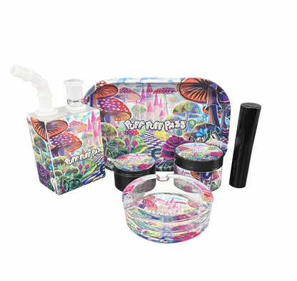 Six‑piece accessory gift set displayed on a pure white background, including a mini bong, grinder, storage tub, holder, ashtray and rolling tray arranged neatly.