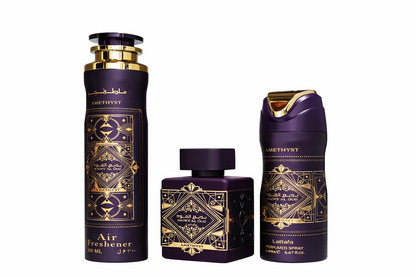 Lattafa Bade’e Al Oud Gift Set shown with Eau de Parfum bottle, deodorant spray and air freshener in premium purple‑and‑gold on a pure white background.