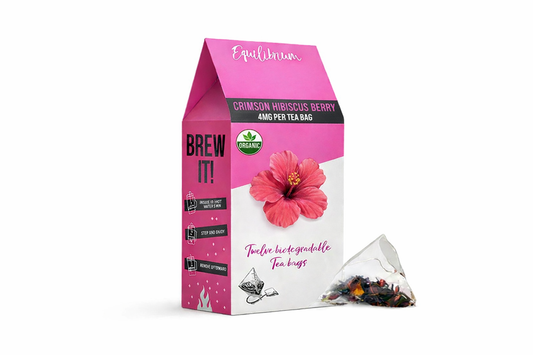 Equilibrium Crimson Hibiscus Berry tea bags displayed in premium botanical packaging on a pure white background with enhanced colour and clear branding.