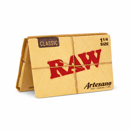 RAW Artesano 1¼ rolling papers with built‑in tray and matching tips single pack shown in natural‑brown branded packaging on a pure white background.