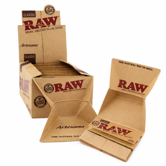 RAW Artesano rolling papers with tips and built‑in tray, full box in natural‑brown branded packaging displayed on a pure white background.