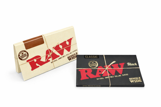 RAW single wide rolling papers in branded packaging displayed on a pure white background