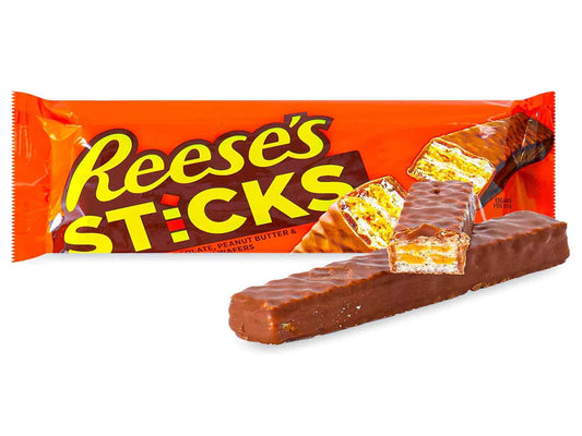 Reese’s Sticks Peanut Butter Wafer Bar 42g in its orange wrapper with bold Reese’s branding, showing the chocolate‑coated peanut butter wafer bar on the front of the packaging on a pure white background.